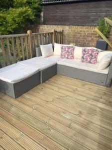 Rattan style garden sofa