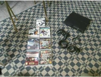 Sony PlayStation 3 Slim 320GB Console - Charcoal Black PLUS 7 GAMES AAND 2 CONTROLLERS