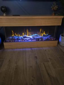 Ilektro Electric Fireplace in timber surround.